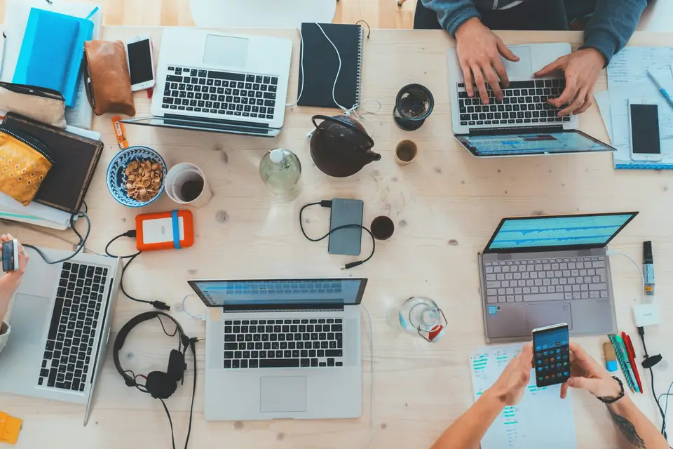Laptops on a shared work table