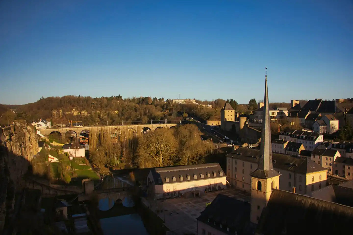 The Grund district and its rooftops in Luxembourg City at golden hour