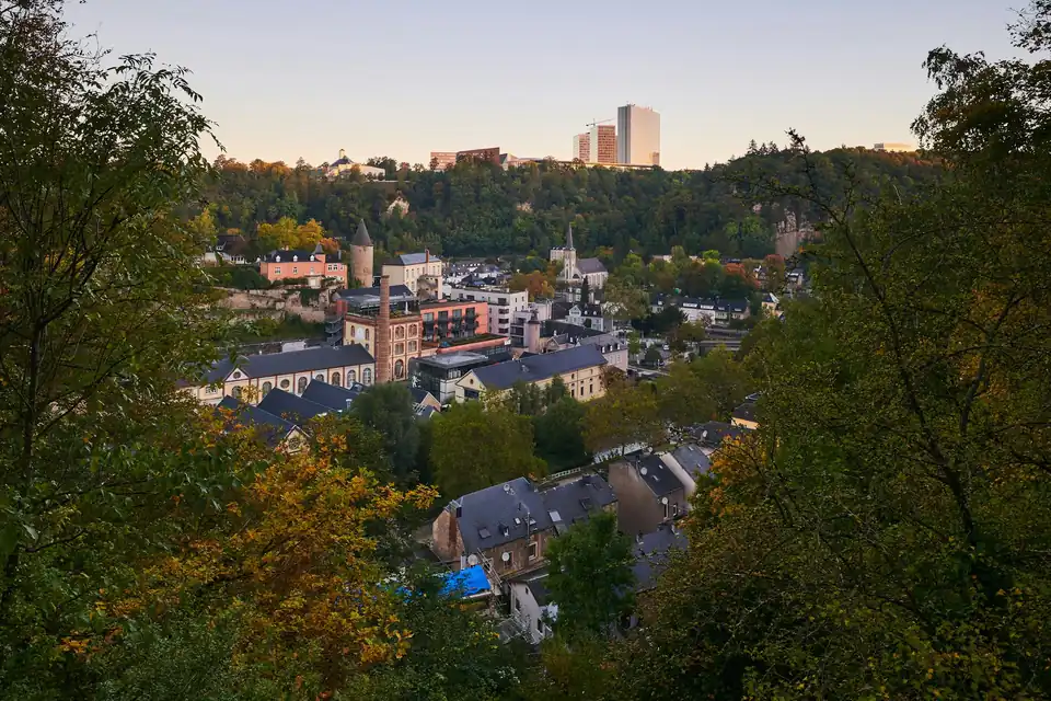 Pfaffenthal valley at dusk with Kirchberg towers