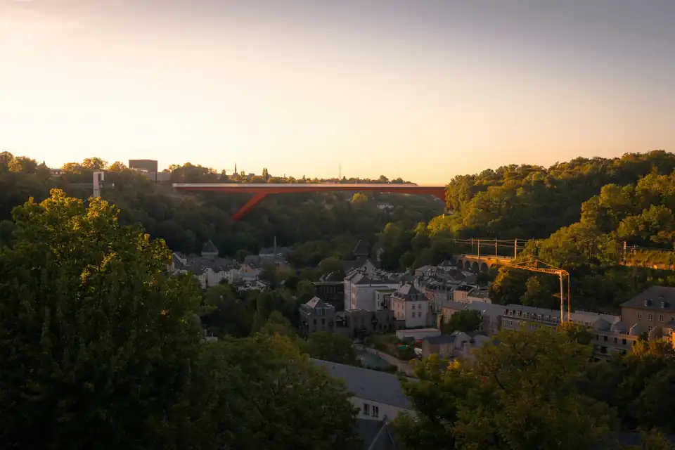 Red Grand Duchess Charlotte Bridge crossing the Pfaffenthal valley at sunset